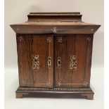 A Victorian rosewood and mother of pearl inlaid tabletop vanity cabinet, the caddy top hinged to