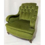 Green velvet button upholstered easy chair with turned legs and ceramic castors