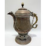 A large copper and brass Islamic Samovar, profusely foliate scroll embossed, height 44cm