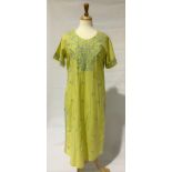 A Biba ladies kaftan dress, lime green cotton with floral and gold thread embroidery, length