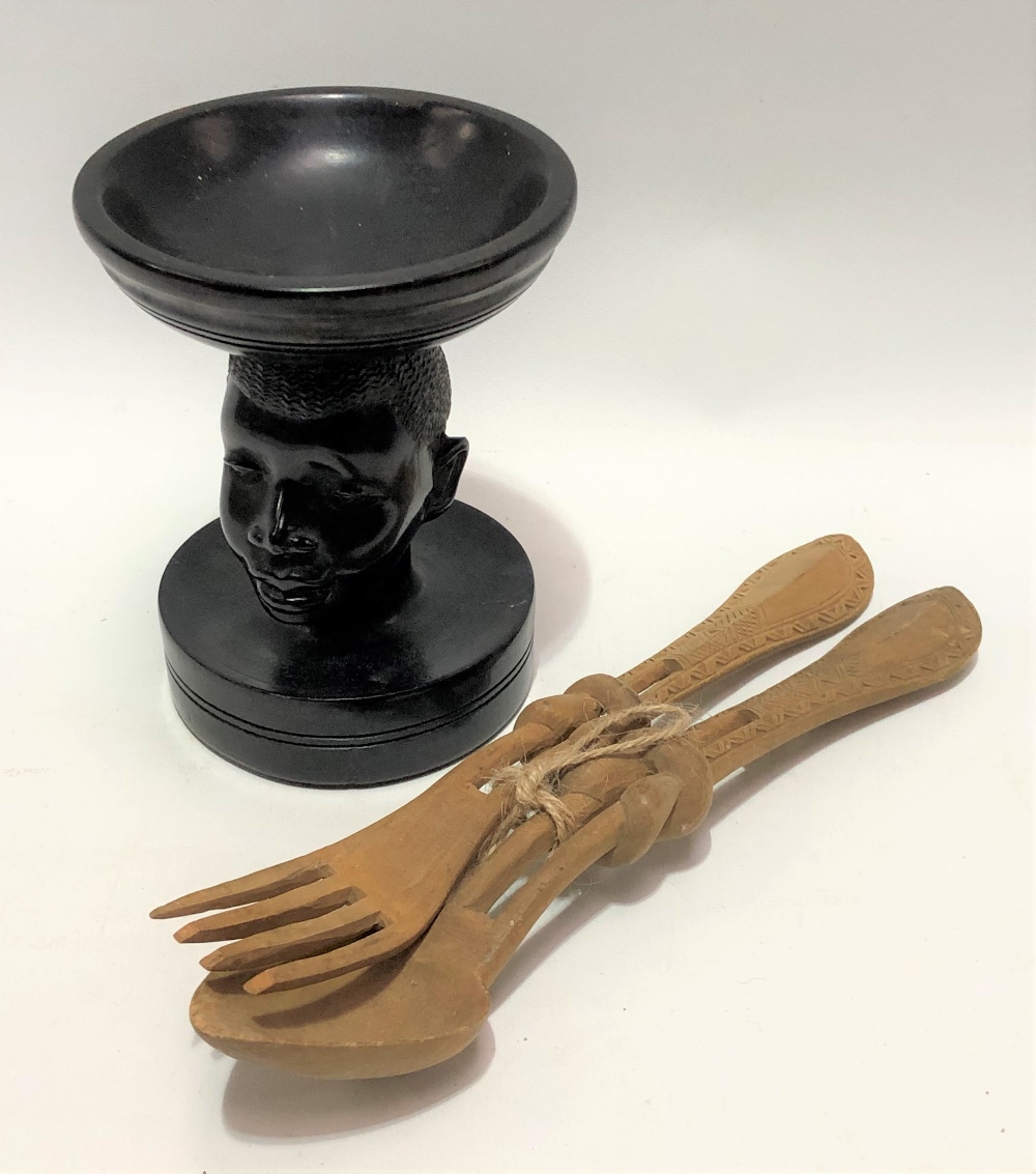 African ebony carved and turned bowl, the pedestal carved as a head, height 12cm; together with a