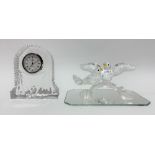 Swarovski crystal bird group upon a mirrored base and with an original cylindrical box; together