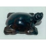 A green and russet flecked jade carved tortoise, width 4.5cm.
