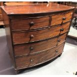 19th Century mahogany bow front chest of two short over three long graduated drawers upon turned