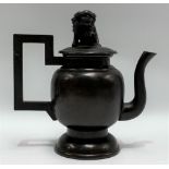 Chinese bronze silver inlaid teapot, the lid with Fo dog, the ovoid body with foliate decoration and