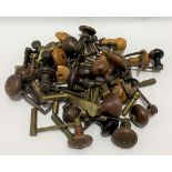 A quantity of clock winding keys with turned wood handles