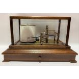 Oak cased barograph by Gluck Co. Ltd., the glazed case over a base with a single drawer, width 37cm