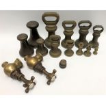 Nine graduated bell weights, set of three graduated Avery weights and a pair of Victorian brass