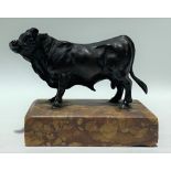 Bronze model of a bull on marble rectangular base, width overall 9.5cm.
