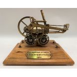 Modern brass scale model of Richard Trevithick's steam locomotive with brass plaque to the wooden