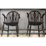 Pair of early 20th Century elm seat wheel, hoop and stick back elbow chairs