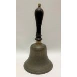 Bonze hand bell with turned ebony handle, height 35cm.