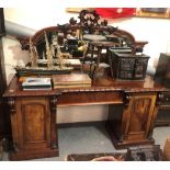 Victorian mahogany mirrored back twin pedestal sideboard, the arched mirror with leaf and foliate