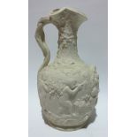 A Copeland parian relief moulded ewer decorated with scenes of putti with grapes and amongst