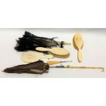 Collection of antique ivory including two parasols and dressing table implements