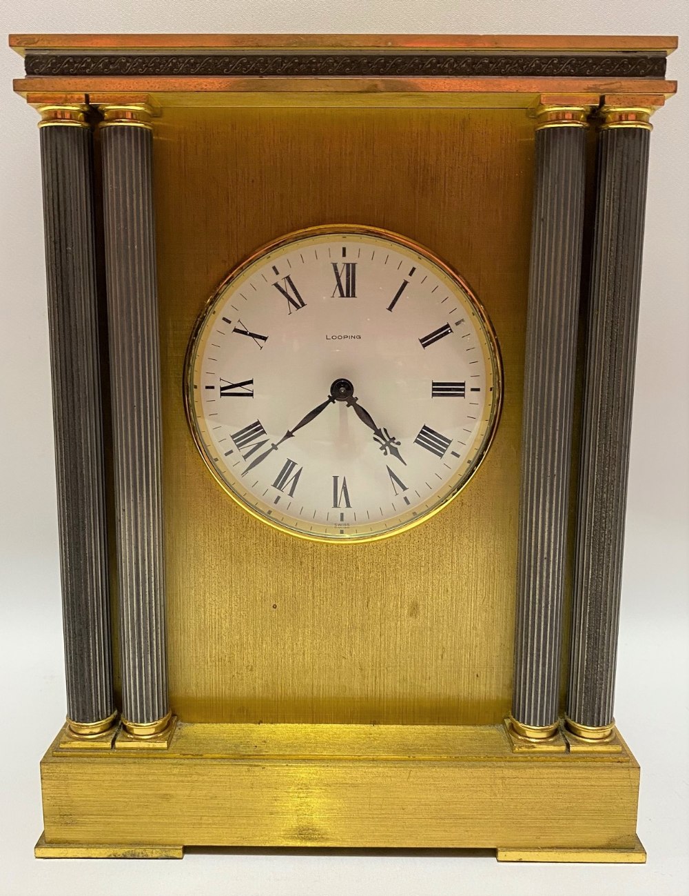 A brass cased mantle clock by Looping, the 4 inch signed enamel dial with roman numerals, the