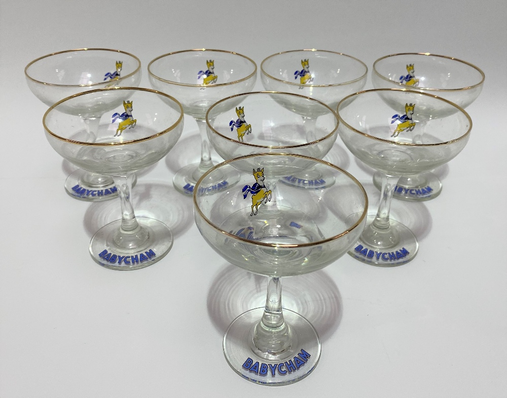 A set of eight Babycham glasses; together with a Beswick Pottery bluebird wall plaque No.706.