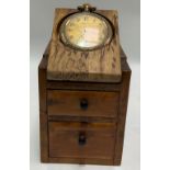 A pocket watch stand with two drawers under together with a gold plated crown wind pocket watch,