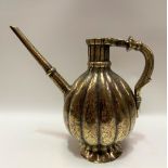 Rare 18th Century Mughal bronze ewer of fluted and footed form with foliate scroll engraved
