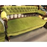 Victorian button-back green velvet upholstered settee, the button-back rail over turned supports,