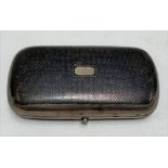 A white metal Niello hinged sewing case with fitted blue velvet interior (lack implements), width