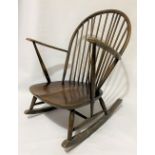 An Ercol rocker with elm seat