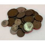 A collection of British and foreign coins, including a halfpenny token, 1811, for the Patent