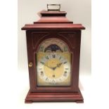 A German three-train bracket style mantle clock by Hermle, the 5in dial with moon phase aperture,