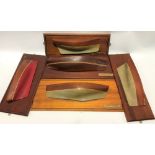 Five Cornish wooden half hull wall-hanging models, three with brass plaques, Mevagissey Lugger,