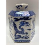 A Chinese blue and white underglaze hexagonal section jar and cover decorated with a pair of five