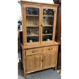 Early 20th Century stripped pine 'Cornish' dresser, the glazed top with three fixed shelves, the