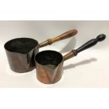 Two copper pans with turned wood handles, the largest diameter 15cm