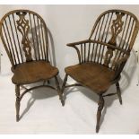 A good set of six 19th Century style elm Windsor chairs including two carvers, each with pierced