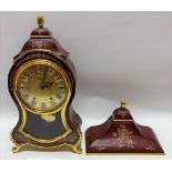 A modern French style two train bracket clock with red foliate painted case, the five inch brass