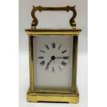 A French brass cased carriage timepiece by Duverdrey & Bloquel, the 2.25in white enamel dial with