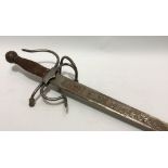 A Spanish sword with etched blade and woven steel grip, length 73cm.