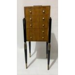 Art Deco continental walnut, ebony and bone inlaid slender chest of five drawers, of square section,