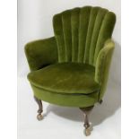 1930's green velvet upholstered scallop back tub chair