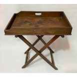A mahogany butler's tray upon folding stand, width of tray 65.5cm