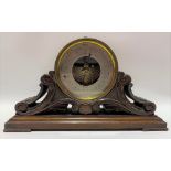 A brass cased aneroid barometer, upon carved and pierced oak leaf scroll stand, the 4.25 inch