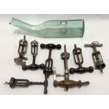 Seven barrel action wine bottle openers; together with a grape storing bottle by Copper Hall