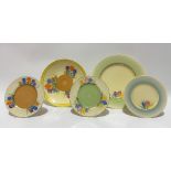 Two Clarice Cliff Newport Pottery crocus pattern plates, together with three crocus pattern side