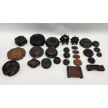 A collection of small Chinese hardwood stands, the largest 12cm diameter