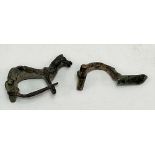 A Roman bronze horse brooch, width 42mm together with another Ancient Roman brooch (2)