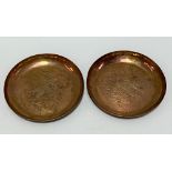 Pair of Newlyn copper circular dishes with hammered decoration of a fish and inscription .H.R.S.C.