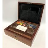 A Victorian fiddle mahogany cased artist's box by J. Newman's Manufactory, the hinged lid