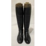 A pair of vintage black leather riding boots with wooden tree lasts by Maxwell London, sole length