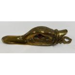 A Victorian brass duck head paperclip with glass inset eyes, width 16cm