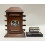 A Victorian oak desk perpetual calendar with three apertures; together with a chromium plated desk