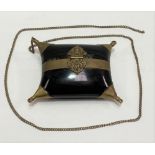 Horn brass mounted purse with strapwork clasp and suspension chain, width 14cm.